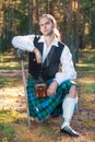 Handsome scottish man with sword and pipe Royalty Free Stock Photo