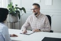 Senior boss interviewing an elegant business woman Royalty Free Stock Photo