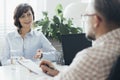 Senior boss interviewing an elegant business woman Royalty Free Stock Photo