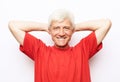 handsome senior man in casual red t-shirt. Isolated on white background. Positive facial emotion. Royalty Free Stock Photo