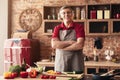 Handsome senior man cooking healthy dinner at kitchen Royalty Free Stock Photo