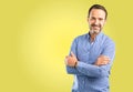 Handsome senior man isolated over yellow background Royalty Free Stock Photo