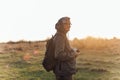 Handsome senior man photographer standing in autumn park and taking pictures with camera Royalty Free Stock Photo