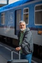 Handsome senior man taking a train Royalty Free Stock Photo