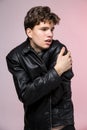 Handsome serious beauty male model portrait wear leather jacket. Man with attitude in leather jacket and jeans. Young sexy gay in Royalty Free Stock Photo