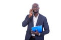 Handsome serious businessman holding clipboard and talking on mobile phone Royalty Free Stock Photo