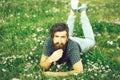 Bearded man laying on green grass Royalty Free Stock Photo