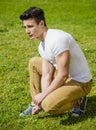 Handsome sexy man outdoors in the grass Royalty Free Stock Photo