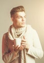 Handsome guy with cup in scarf