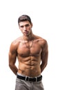 Handsome shirtless athletic young man on white