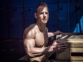 Handsome shirtless muscular man posing in gym Royalty Free Stock Photo