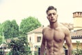 Handsome shirtless muscular young man outdoor