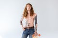 handsome shirtless tattooed sportsman with curly hair standing with longboard Royalty Free Stock Photo