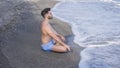 Young Man Meditating or Doing Yoga Exercise by Sea Royalty Free Stock Photo