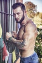 Handsome shirtless young man outdoor
