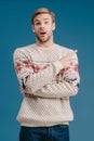 handsome shocked man in winter sweater