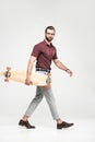 handsome skateboarder posing with longboard, Royalty Free Stock Photo