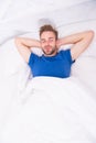 Handsome and sleepy. Sexy man sleeping in bed. Relaxing man in bedroom. Attractive single man being calm and relaxed Royalty Free Stock Photo