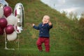 Handsome smile portrait baby. 1 year old cute boy on the grass. Birthday anniversary. Royalty Free Stock Photo