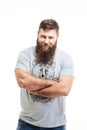 Handsome smiling bearded man standing with arms crossed Royalty Free Stock Photo
