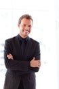 Handsome smiling businessman with folded arms Royalty Free Stock Photo