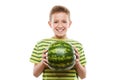 Handsome smiling child boy holding green watermelon fruit Royalty Free Stock Photo