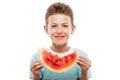 Handsome smiling child boy holding red watermelon fruit slice Royalty Free Stock Photo