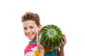 Handsome smiling child boy holding green watermelon fruit Royalty Free Stock Photo