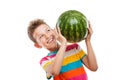 Handsome smiling child boy holding green watermelon fruit Royalty Free Stock Photo