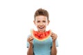 Handsome smiling child boy holding red watermelon fruit slice Royalty Free Stock Photo