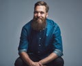 Handsome smiling man in blue shirt and beard Royalty Free Stock Photo