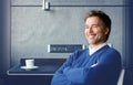 Handsome smiling man sitting at the desk relaxing Royalty Free Stock Photo