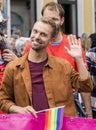 2019: Handsome smiling man waving at the camera at the Gay Pride parade also known as Christopher Street Day CSD in Munich