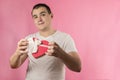 A man with a heart-shaped gift box Royalty Free Stock Photo