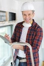 Handsome smiling worker indoors Royalty Free Stock Photo