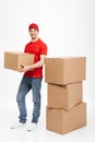 Handsome smiling young delivery man Royalty Free Stock Photo