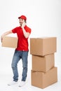 Handsome smiling young delivery man Royalty Free Stock Photo