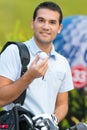 Handsome smiling young male golfer holds ball Royalty Free Stock Photo