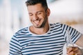 handsome smiling young man holding glass bottle Royalty Free Stock Photo