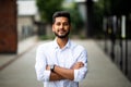 Handsome smiling young indian man portrait. Cheerful men with crossed arms looking at camera in city. People, lifestyle, male Royalty Free Stock Photo