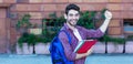 Handsome spanish male student cheering about graduation Royalty Free Stock Photo