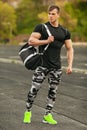 Handsome sport man in sportswear outdoor. Athletic male outside