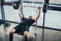 handsome sportive man lifting barbell with weights while lying on bench Royalty Free Stock Photo