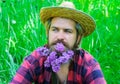 Handsome spring man with beard of flowers. Bearded male with decorated beard. Royalty Free Stock Photo