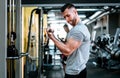 Handsome strong athletic man working triceps and biceps muscles. workout fitness and bodybuilding healthy concept Royalty Free Stock Photo