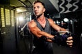 Handsome strong bodybuilder pushing up excercise in gym Royalty Free Stock Photo