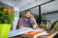 Handsome student studying in restaurant Royalty Free Stock Photo