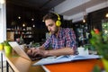 Handsome student studying in restaurant Royalty Free Stock Photo