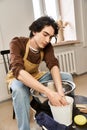 Handsome stylish man creates pottery in Royalty Free Stock Photo