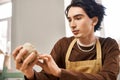 Handsome stylish man creating pottery in Royalty Free Stock Photo
